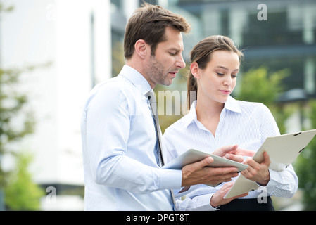 Business associates collaborating using digital tablet Stock Photo