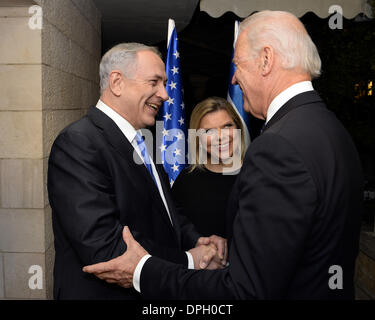 US Vice President Joe Biden is greeted by Israeli Prime Minister Benjamin Netanyahu and his wife Sara Netanyahu upon arrival for his bilateral meeting at the Prime Minister's residence January 13, 2013 in Jerusalem, Israel. Stock Photo
