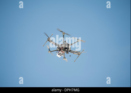 An unmanned Aerial Vehicle (UAV) / drone used for aerial surveillance is flying in the air Stock Photo