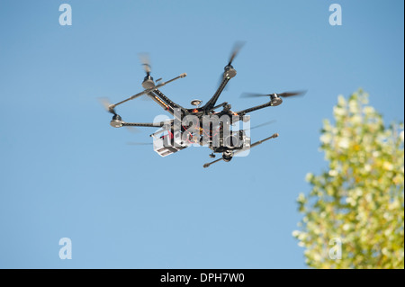 An unmanned Aerial Vehicle (UAV) / drone used for aerial surveillance is flying in the air Stock Photo