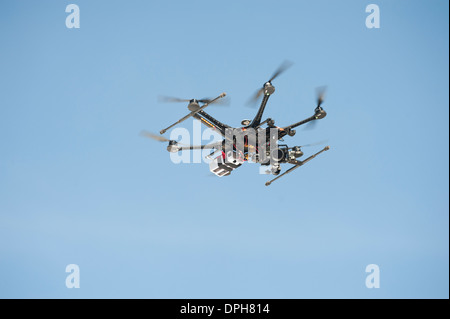 An unmanned Aerial Vehicle (UAV) / drone used for aerial surveillance is flying in the air Stock Photo
