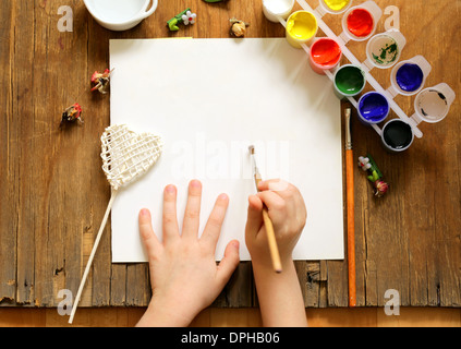 painting set - brushes, paints (gouache) on old wooden table Stock Photo