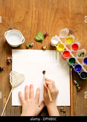 painting set - brushes, paints (gouache) on old wooden table Stock Photo