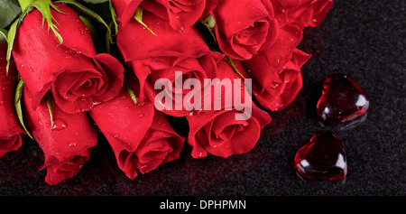 Red roses on black ceramic background Stock Photo