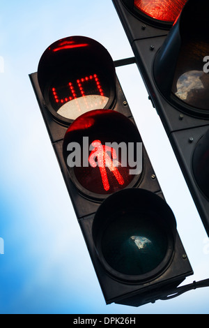 Red stop signal with timer on street pedestrian traffic light Stock Photo