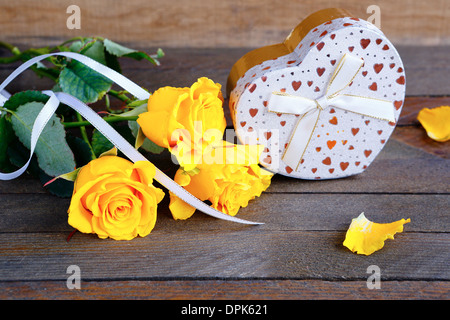 bouquet of roses and a gift, valentine's day, holiday Stock Photo