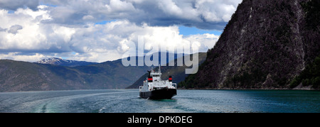 Ferry in mountains surrounding Aurlandsfjorden Fjord, Sogn Og Fjordane region of Norway, Scandinavia, Europe. Stock Photo