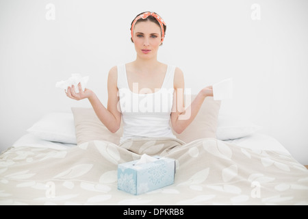 Sick woman holding handkerchiefs