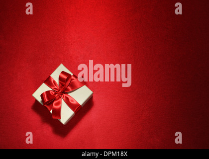 White gift box on red background Stock Photo