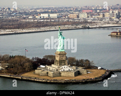 The Statue of Liberty is a colossal neoclassical sculpture on Liberty Island in the middle of New York Harbor, in Manhattan, New York City. Stock Photo