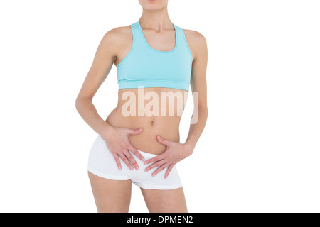 Mid section of slender young woman wearing sportswear Stock Photo