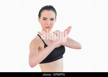 Fit young woman standing in defending posture Stock Photo