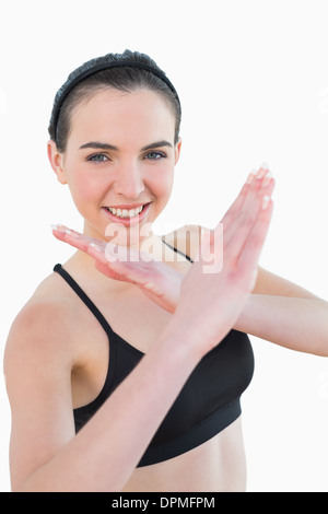 Fit young woman standing in defending posture Stock Photo