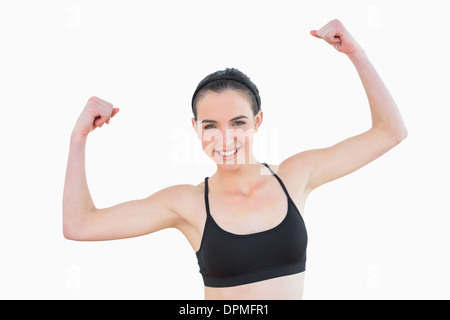 Portrait of sporty fit young woman clenching fists Stock Photo