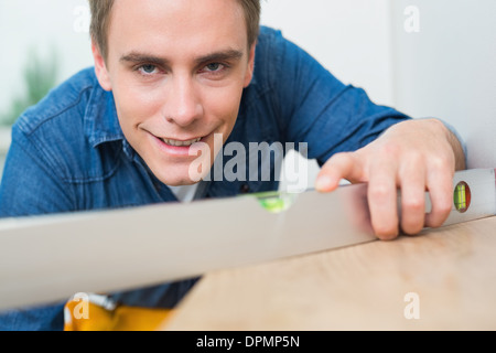 Close up of a handyman using a spirit level Stock Photo