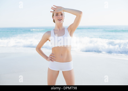 Cheerful slender woman touching her forehead Stock Photo
