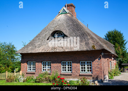 Thatched house in the village of Sieseby,Schleswig-Holstein,Germany Stock Photo
