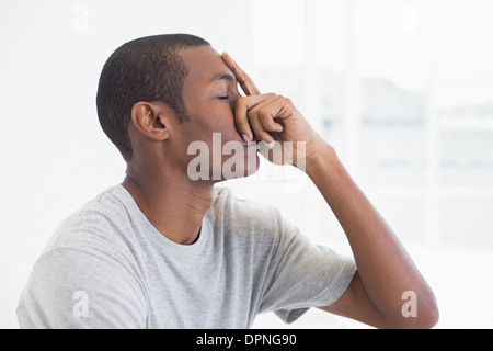 Close up side view of a thoughtful young Afro man Stock Photo