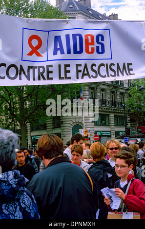 Paris, France, AIDS Activists from AIDES NGO, Carrying Protest Banner at Anti-Extreme Right Demonstration, Stock Photo