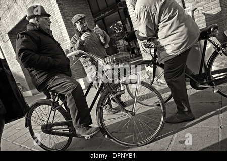 Conversation by the Palazzo Municipio in Ferrara, Emilia Romagna. Stock Photo