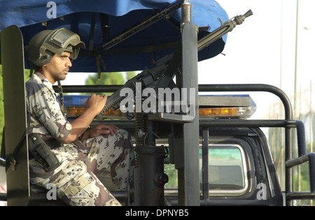 Saudi Army soldiers on duty with police stop searching cars looking for extremists and checking car licenses. Stock Photo
