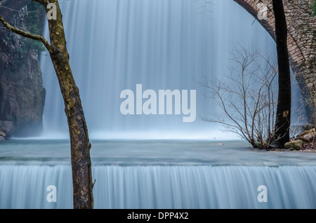 The double waterfall with stone bridge at Palaiokaria Stock Photo