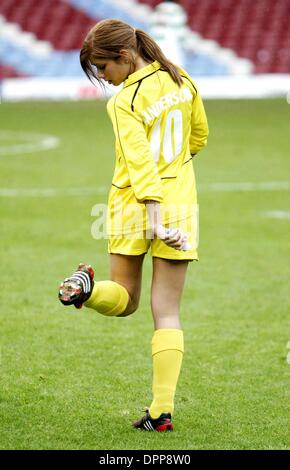 May 21, 2006 - Upton Park Stadium, LONDON, ENGLAND - NIKKI SANDERSON.CHECKING HER STUDS AT THE 2006 CELEBRITY WORLD CUP SOCCER SIXES TOURNAMENT AT UPTON PARK, WEST HAM UNITED'S FOOTBALL GROUND IN LONDON. 05-21-2006.Â©  -   K48038(Credit Image: © Globe Photos/ZUMAPRESS.com) Stock Photo