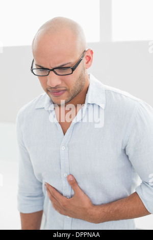Casual man suffering from chest pain at home Stock Photo