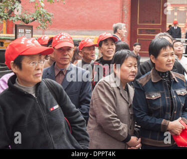 Beijing, China. 26th Oct, 2006. A group of Chinese tourists read a descriptive sign in the Forbidden City, a major tourist attraction in Beijing, capital of the Peoples Republic of China. © Arnold Drapkin/ZUMAPRESS.com/Alamy Live News Stock Photo