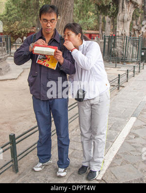 Beijing, China. 26th Oct, 2006. A Chinese couple look at their guide map in the Forbidden City, a major tourist attraction in Beijing, capital of the Peoples Republic of China. © Arnold Drapkin/ZUMAPRESS.com/Alamy Live News Stock Photo