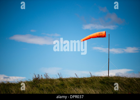 A windsock blows in strong wind at Ushuaia Airport, Argentina. Stock Photo