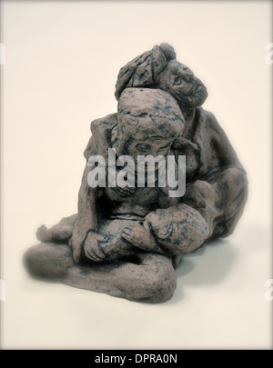 Figurine of two people comforting each other Stock Photo