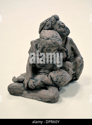 Figurine of two people comforting each other Stock Photo