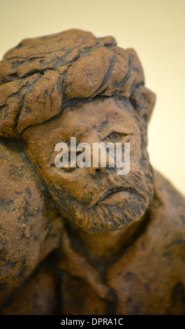 Figurine of two people comforting each other Stock Photo