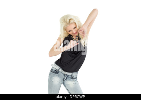 Happy young casual woman dancing Stock Photo