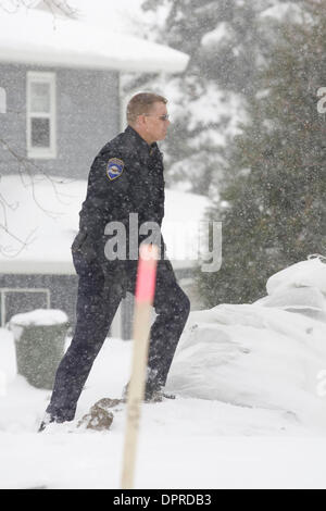 March 31, 2009 - Moorhead, Minnesota, USA - Moorhead police officer BRIAN DAHL examine a dike in Moorhead, Minn. along the Red River on foot during a snowstorm Tuesday, March 31, 2009. Up to 18 inches of new snow are expected to fall in the Fargo, N.D. and Moorhead area by Wednesday. (Credit image: © Dave Arntson/ZUMA Press) Stock Photo