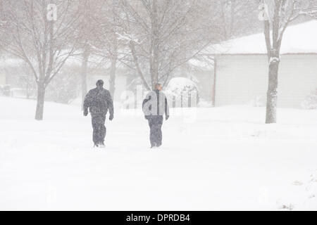 March 31, 2009 - Moorhead, Minnesota, USA - Moorhead police officers JEFF NELSON, left, and BRIAN DAHL patrol a Moorhead, Minn. neighborhood along the Red River on foot during a snowstorm Tuesday, March 31, 2009. Up to 18 inches of new snow are expected to fall in the Fargo, N.D. and Moorhead area by Wednesday. (Credit image: © Dave Arntson/ZUMA Press) Stock Photo