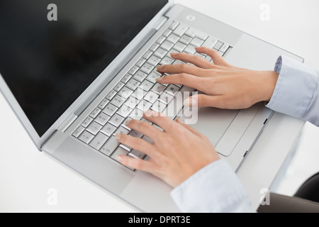 Close up of hands using laptop Stock Photo