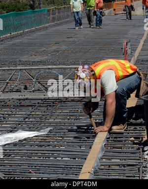 Brian Merryman works on a bridge over Mission Boulevard (238) along Interstate 680 in Fremont, Calif., on Monday, April 20, 2009. The freeway is being widened to create High Occupancy Toll lanes that will allow non-carpool drivers to pay via transponder to access the lane. Those who carpool will continue to use the lane for free. (Cindi Christie/Staff) Stock Photo