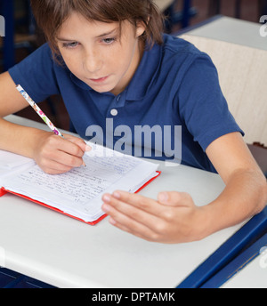 Schoolboy Cheating During Examination Stock Photo