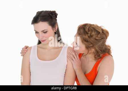 Young woman consoling female friend Stock Photo