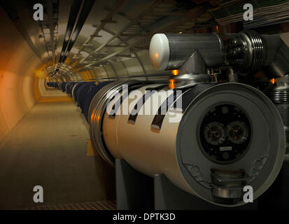 Jan 12, 2009 - Geneva, Switzerland - A photograph shows visitors what the LHC tunnel looks like in the visitors centre at CERN. Access to the actual tunnel is restricted as the superconductor magnets shown are cooled to -271 degrees celcius. CERN ( the European Centre for Nuclear Research) developed the Large Hadron Collider (LHC) to carry out research into high energy particle col Stock Photo