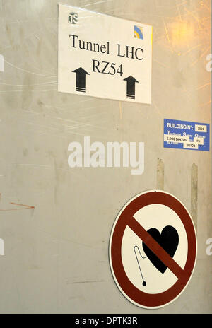 Jan 12, 2009 - Geneva, Switzerland - Door to the Large Hadron Collider (LHC) tunnel warns of restricted access to workers with pacemakers, due to high magnetic fields used in the accelerator. CERN ( the European Centre for Nuclear Research) developed the Large Hadron Collider (LHC) to carry out research into high energy particle collisions.  Protons accelerated at near light speed  Stock Photo