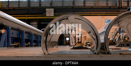 Jan 12, 2009 - Geneva, Switzerland - A technician in the magnet repair hall at CERN near Geneva. Recent damage to magnets, caused by an electrical fault, during initial switch-on of the Large Hadron Collider means up to fifty 14m long magnets have to be overhauled after being brought up from the accelerator tunnel below. CERN ( the European Centre for Nuclear Research) developed th Stock Photo