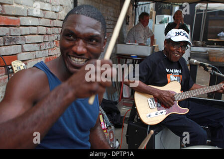 Apr 18, 2009 - Clarksdale, Mississippi, USA - Cedric Burnside, left, with James 'T-Model' Ford perform downtown Clarksdale during the 6th annual Juke Joint Festival which showcases Mississippi Delta Blues music. Burnside, 31, follows in the footsteps of his grandfather and father as Blues artist and T-Model, 84, has been a singer/song writer/ guitarist for most of his life. The act Stock Photo