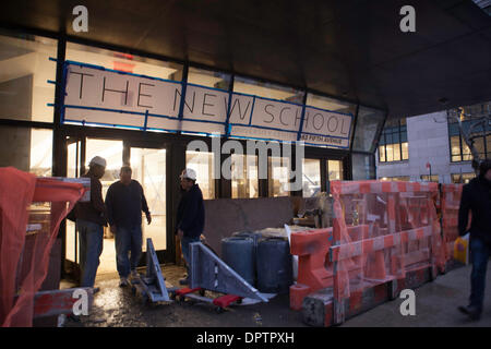 New York, USA. 15th January 2014. Construction workers at 63 Fifth Avenue the site of the new New School student building. The street directly in front of the building is where the water main burst early Wednesday morning. Credit:  Mansura Khanam/Alamy Live News Stock Photo