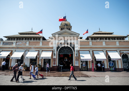 SANTIAGO, Chile - The main entrance to Mercado Central de Santiago, Chile's central market. The market specializes in seafood, a staple food category of Chilean cuisine. The building is topped with an ornate cast-iron roof. This 19th-century market is a testament to Santiago's vibrant food culture and is a significant place for both locals and tourists to explore authentic Chilean gastronomy. Stock Photo