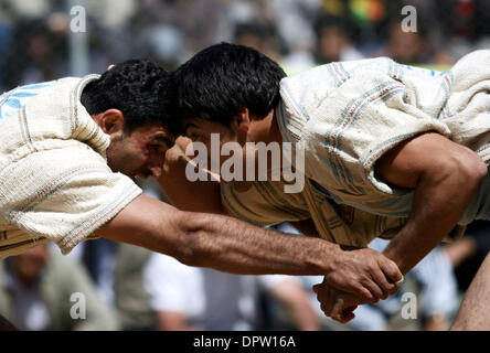 Apr 02, 2009 - North Khorasan, Iran - Iranian wrestlers fight during a traditional form of wrestling called Bachokheh on the last day of Nowrouz being held for over 100 years in the city of Fariman in north North Khorasan province 733Km (425 miles) northeast of Tehran. (Credit Image: © Hossein Fatemi/ZUMA Press) Stock Photo