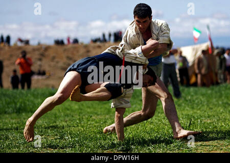 Apr 02, 2009 - North Khorasan, Iran - Iranian wrestlers fight during a traditional form of wrestling called Bachokheh on the last day of Nowrouz being held for over 100 years in the city of Fariman in north North Khorasan province 733Km (425 miles) northeast of Tehran. (Credit Image: © Hossein Fatemi/ZUMA Press) Stock Photo