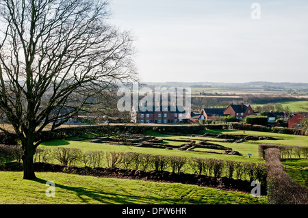 Roman ruins at Letocetum from St John’s Church Wall near Lichfield Staffordshire England with local housing behind Stock Photo